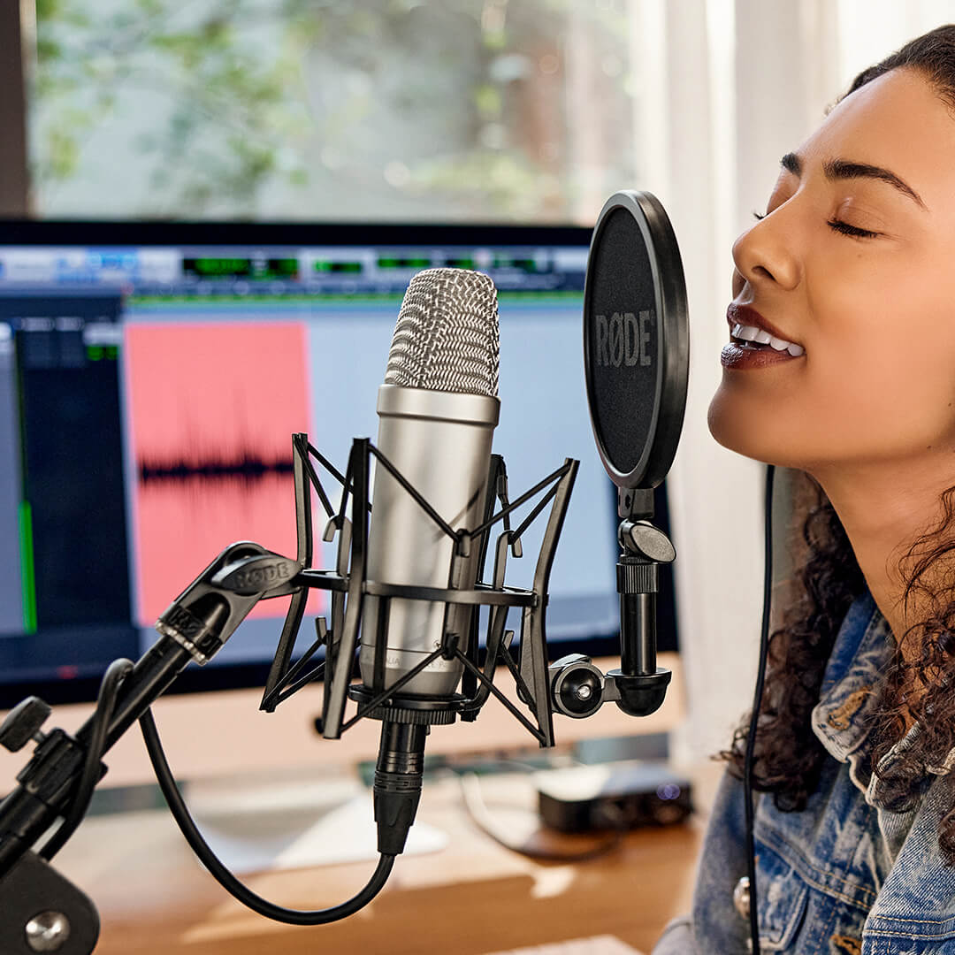 Girl singing into NT1-A on SM6 with Pro Tools recording in background